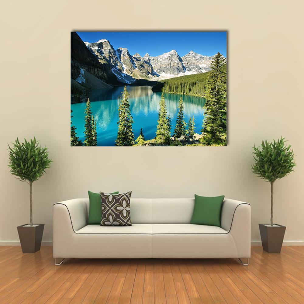 Moraine Lake Surroundings Canvas Wall Art in gray, green and blue, single panel hung on a wall