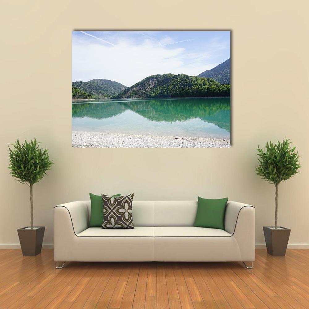 Turquoise Lake with Mountain Reflections Canvas Wall Art in white, green and blue, single panel hung on a wall