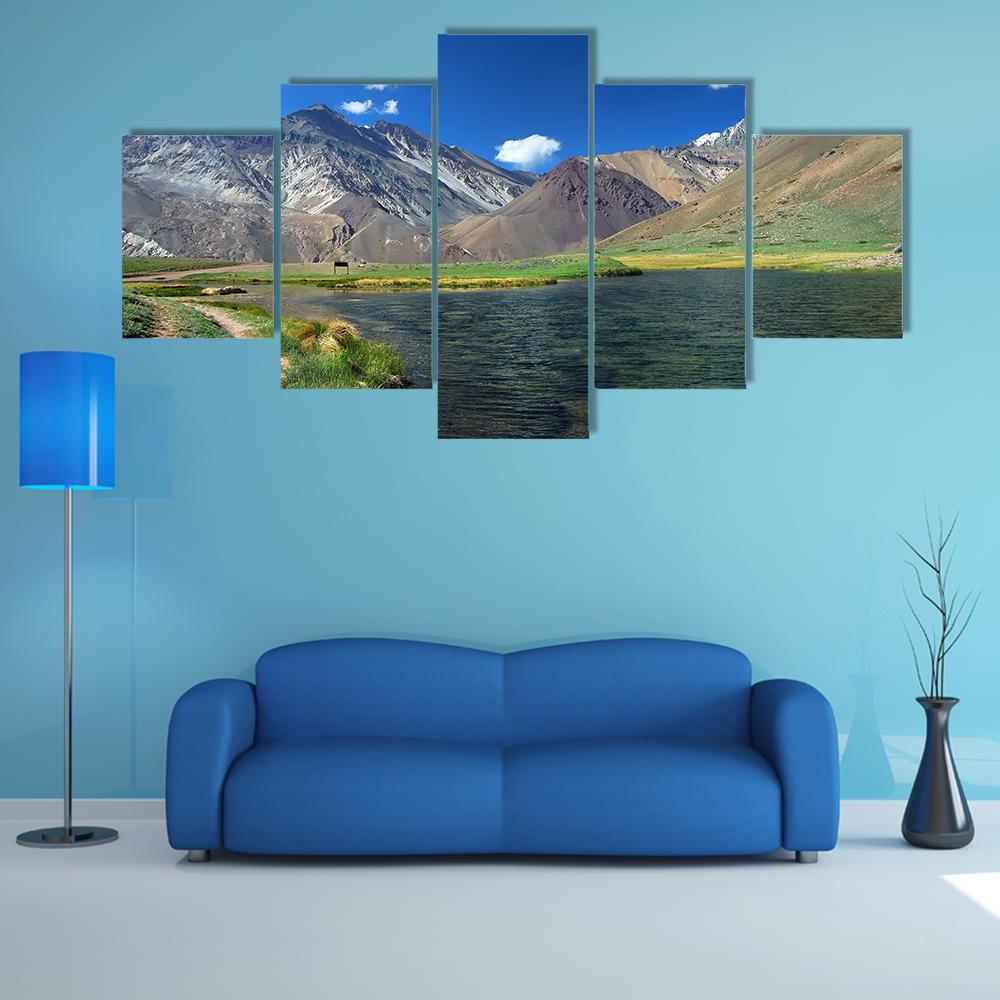 Mountain Lake with Snow-capped Peaks Canvas Wall Art in brown, green and blue, 5 panel Star layout hung on a wall