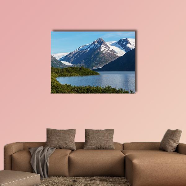 Alpine Lake and Glacier Mountains Canvas Wall Art in white, green and blue, single panel hung on a wall