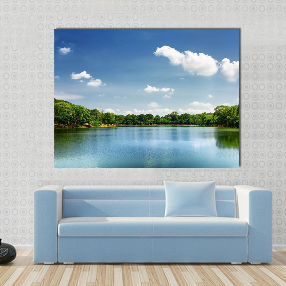 Lake Nestled Among Rain Forest in Cambodia Canvas Wall Art in green and blue, single panel hung on a wall