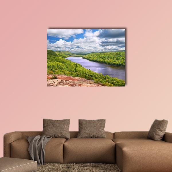 Lake of the Clouds Landscape Canvas Wall Art in white, green and blue, single panel hung on a wall