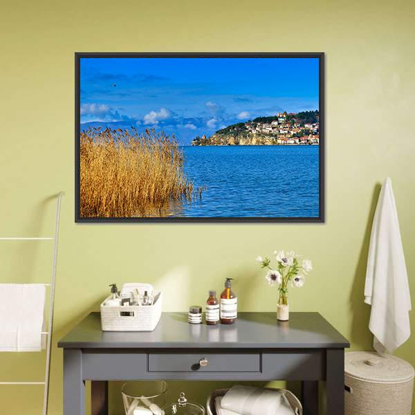 Lake Ohrid Reeds and Mountain Town Canvas Wall Art in brown, yellow and blue, framed canvas, product view on a white background
