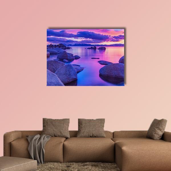 Lake Tahoe Sunrise with Smooth Foreground Rocks Canvas Wall Art in blue, purple and pink, single panel hung on a wall