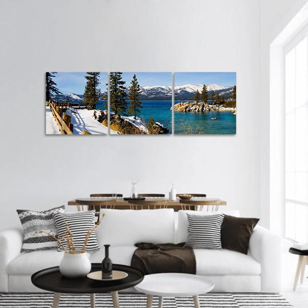 Lake Tahoe Winter Shoreline Panoramic Canvas Wall Art in white, brown and blue, hung on a wall