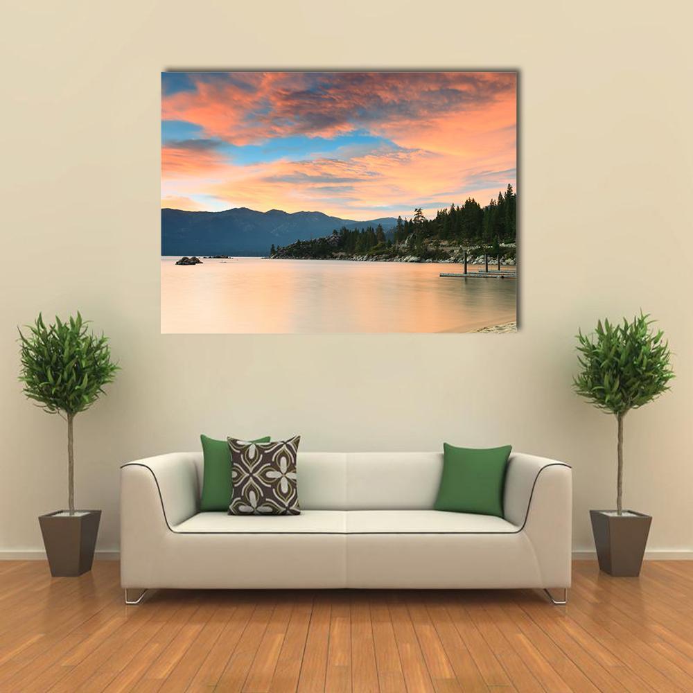 Lake Tahoe Sunset Over Pier Canvas Wall Art in beige, orange and blue, single panel hung on a wall