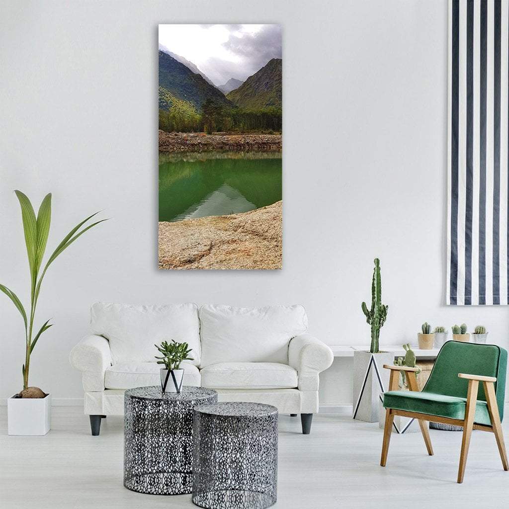 Reflection on Mountain Lake Vertical Canvas Wall Art in gray, beige and green, single vertical panel hung on a wall