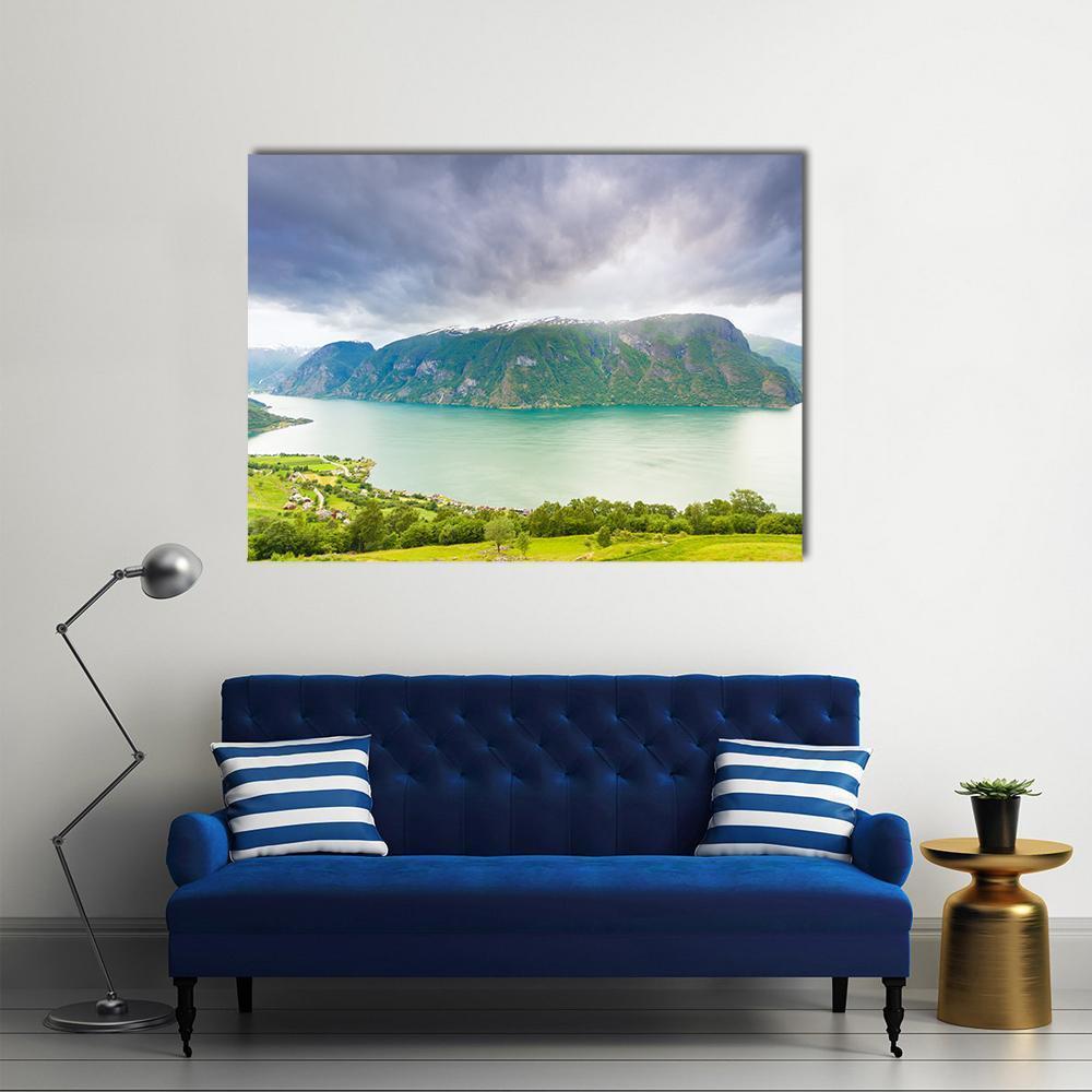 Norway Fjord with Village and Snow-capped Peaks Canvas Wall Art in gray, green and blue, single panel hung on a wall
