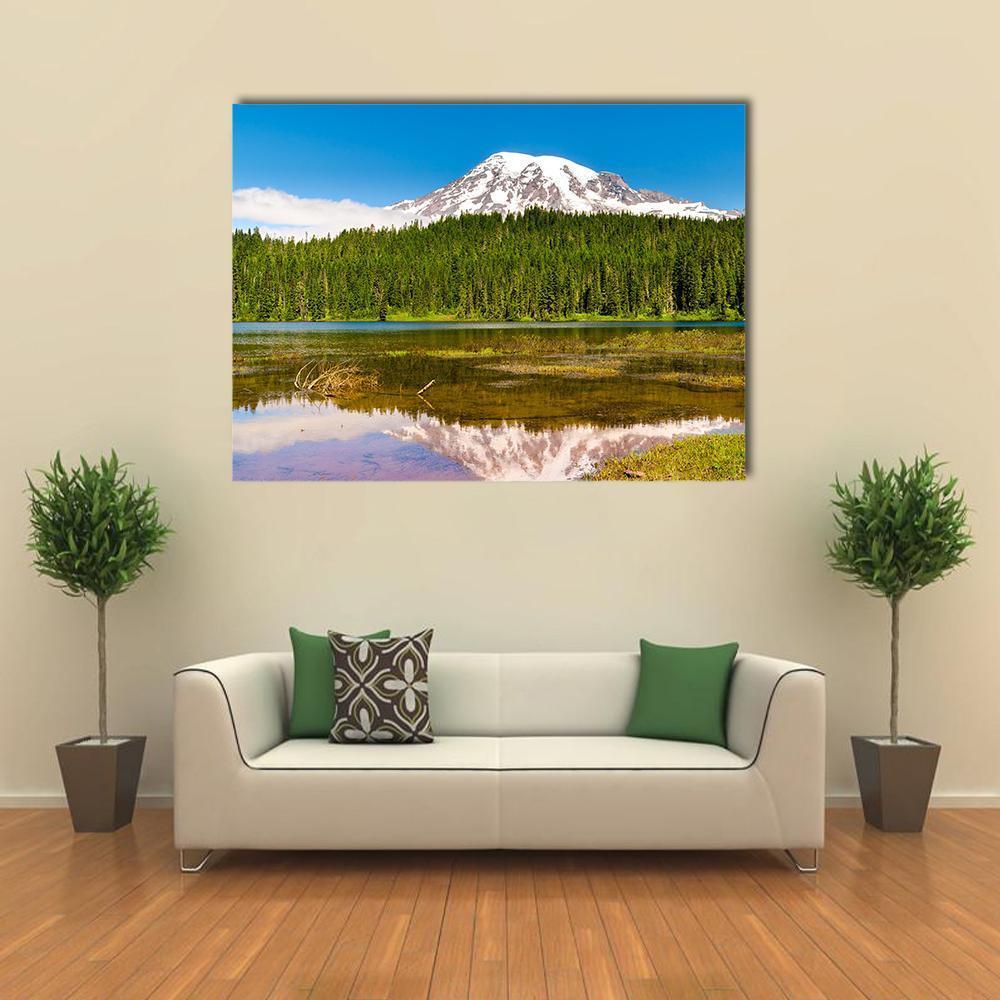 Forest Lake and Snow-capped Mountain Canvas Wall Art in white, green and blue, single panel hung on a wall