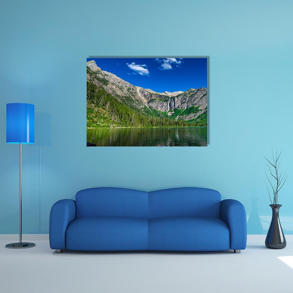 Lake with Forest and Mountains Canvas Wall Art in gray, green and blue, single panel hung on a wall