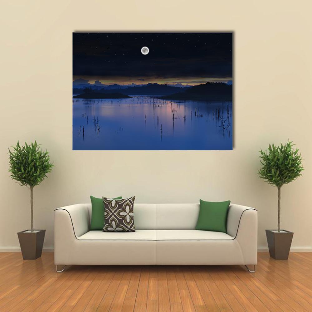 Full Moon Over Lake Canvas Wall Art in black, blue and navy, single panel hung on a wall
