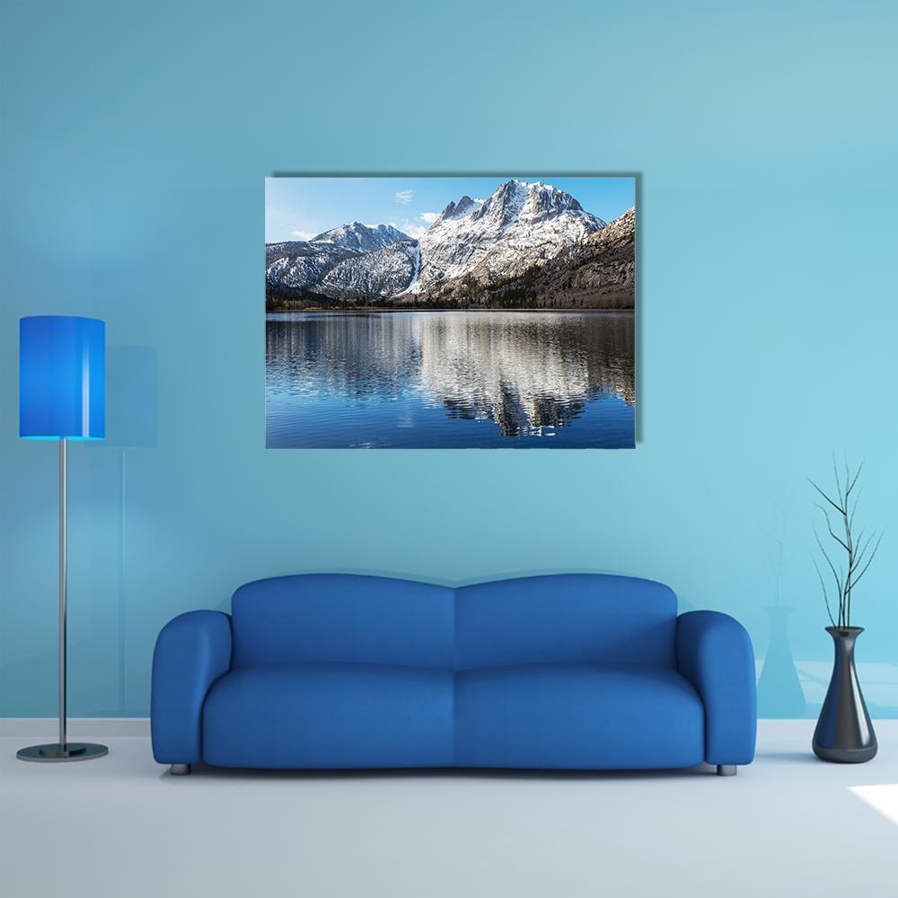 Snow-capped Mountain Reflection with Blue Sky Canvas Wall Art in white, gray and blue, single panel hung on a wall