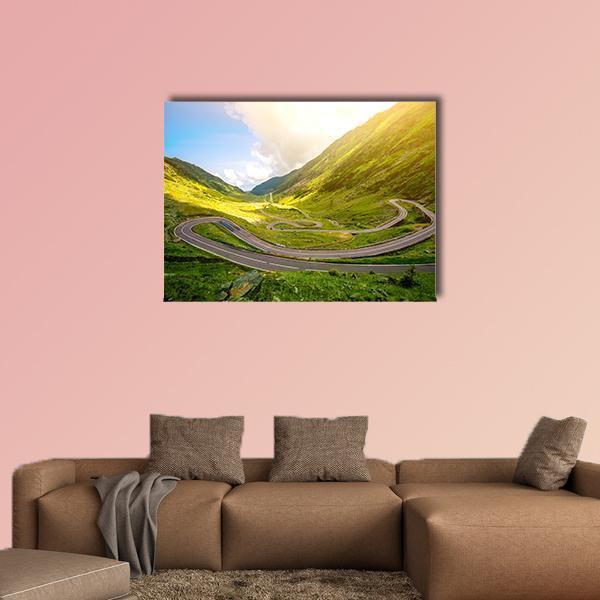 Transfagarasan Winding Road Canvas Wall Art in gray, yellow and green, single panel hung on a wall