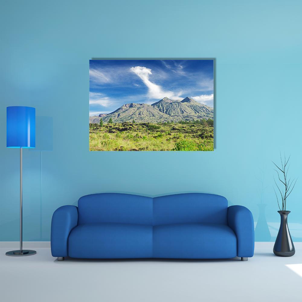 Serene Volcano and Mountain Grassland Canvas Wall Art in gray, green and blue, single panel hung on a wall
