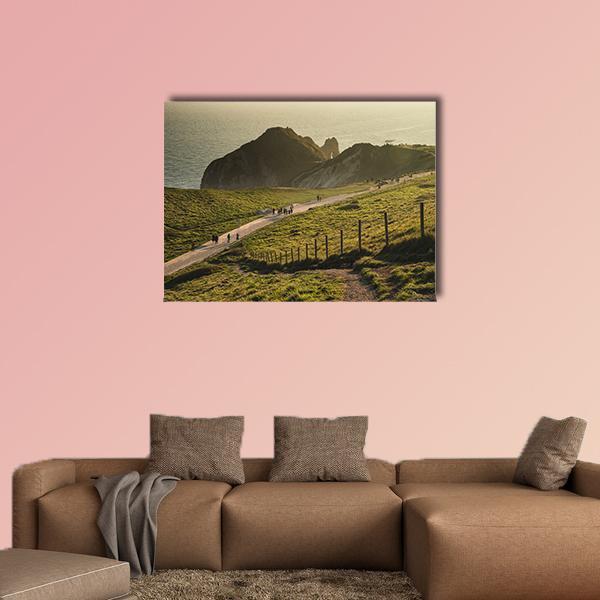 Durdle Door Coastal Landscape Canvas Wall Art in brown, yellow and green, single panel hung on a wall