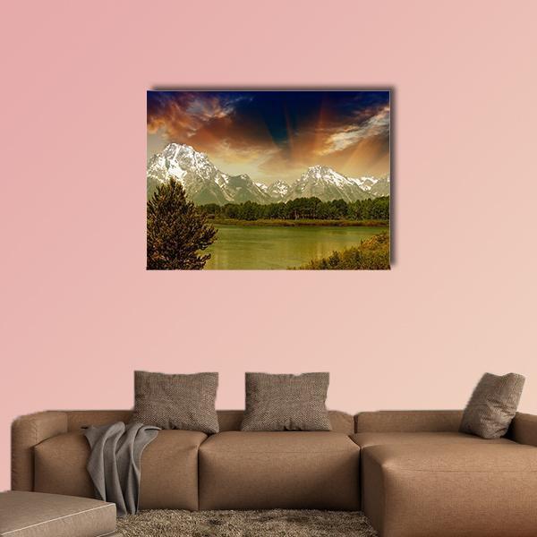 Grand Teton Lake Reflection at Sunset Canvas Wall Art in orange, green and blue, single panel hung on a wall