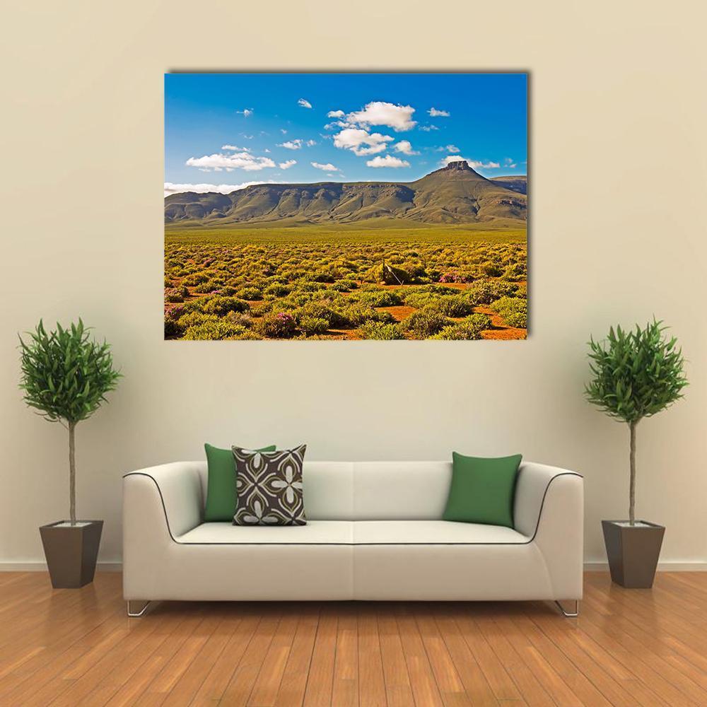 Tankwa Karoo Landscape with Flat-topped Mountain Canvas Wall Art in brown, green and blue, single panel hung on a wall