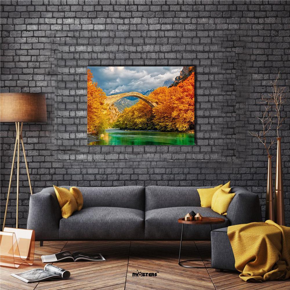 Konitsa Bridge in Autumn Canvas Wall Art in orange, yellow and green, single panel hung on a wall