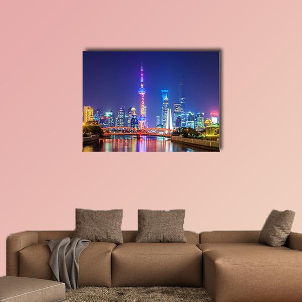 Lujiazui Shanghai Skyline at Night Canvas Wall Art in gold, blue and purple, single panel hung on a wall
