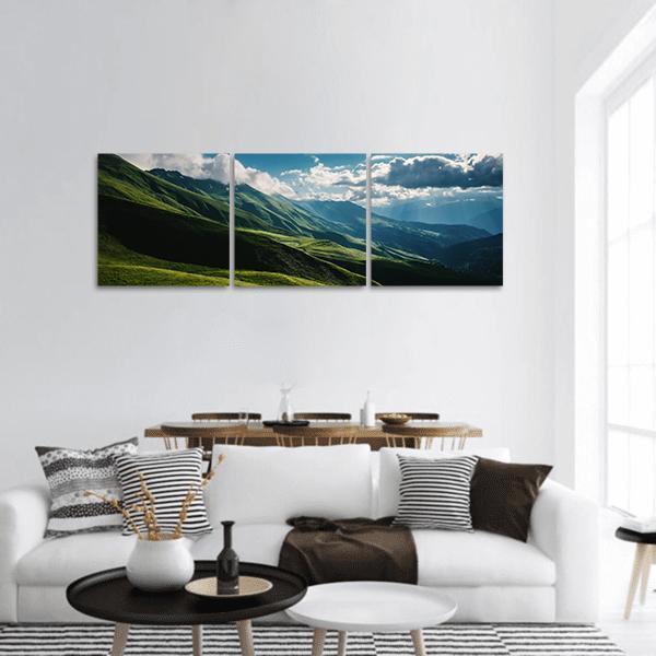Green Mountains at Golden Hour Panoramic Canvas Wall Art in green and blue, hung on a wall