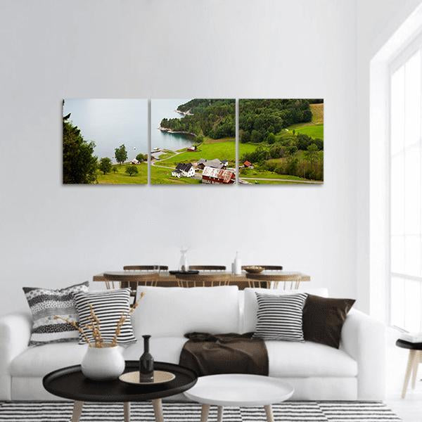 Norwegian Countryside Farm and Fjord Panoramic Canvas Wall Art in white, green and blue, hung on a wall