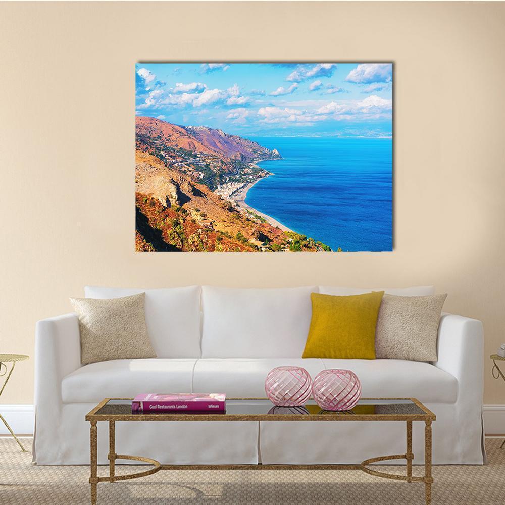 White Coastal Town by Blue Ocean Canvas Wall Art in white, brown and blue, single panel hung on a wall