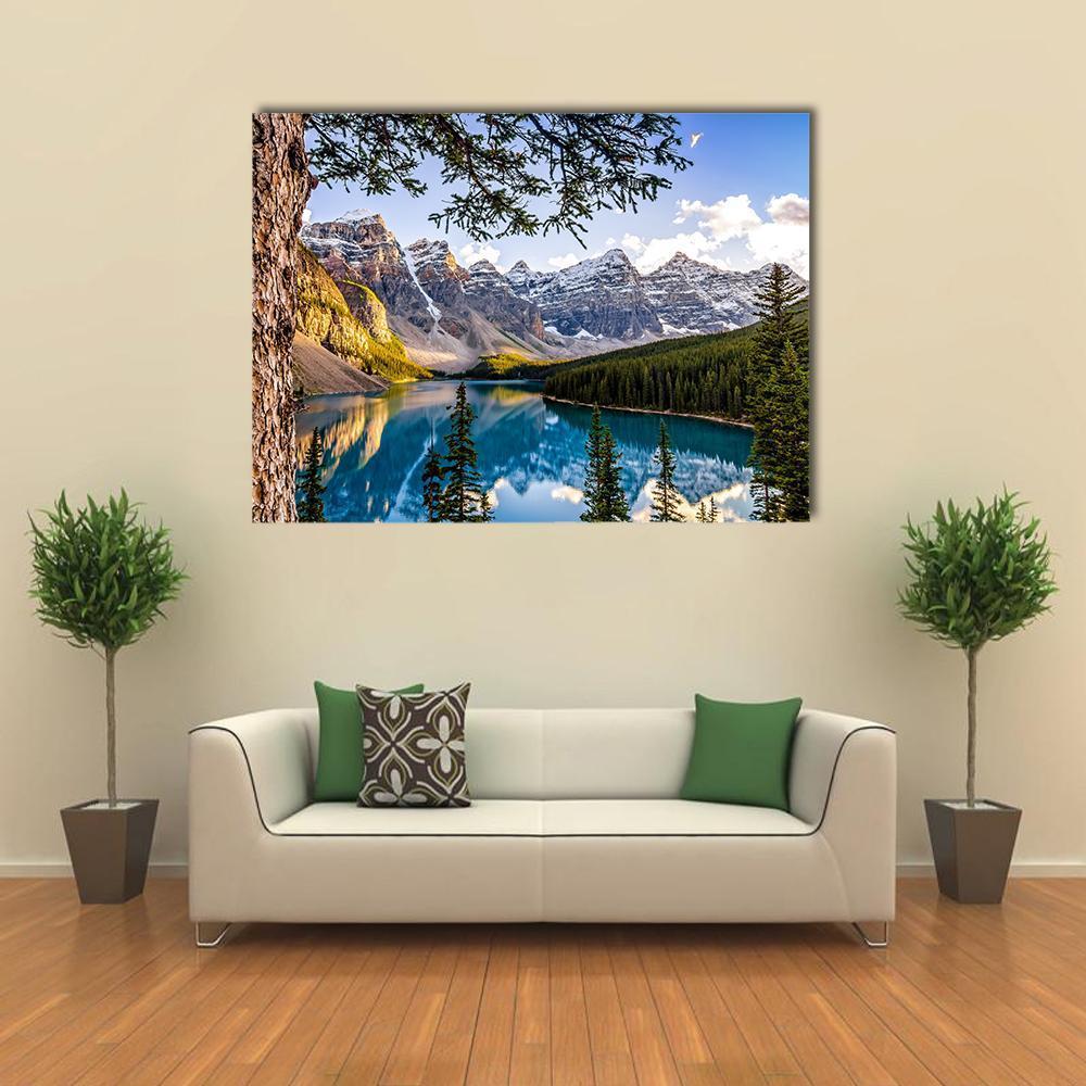 Moraine Lake Reflection with Snow-capped Mountains Canvas Wall Art in white, green and blue, single panel hung on a wall