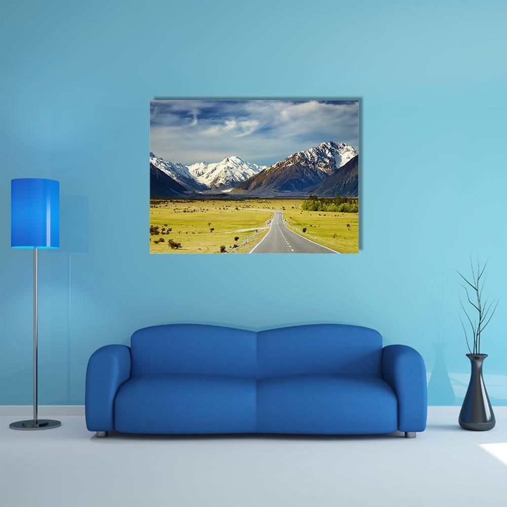 Road to Snow-capped Mountains Canvas Wall Art in white, yellow and blue, single panel hung on a wall
