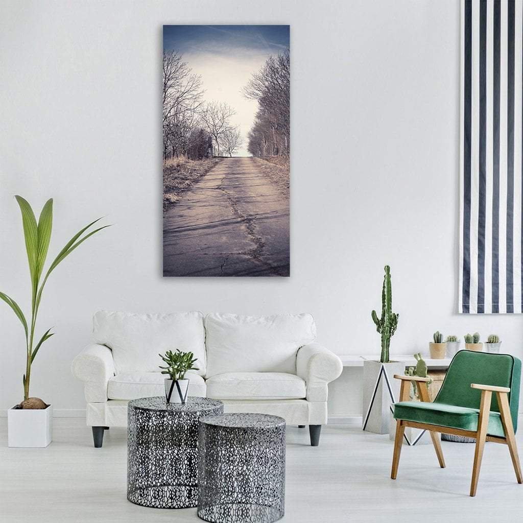 Cracked Country Lane Vertical Canvas Wall Art in gray, beige and blue, single vertical panel hung on a wall