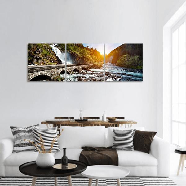 Latefossen Waterfall and Stone Arched Bridge Panoramic Canvas Wall Art in gray, yellow and green, hung on a wall