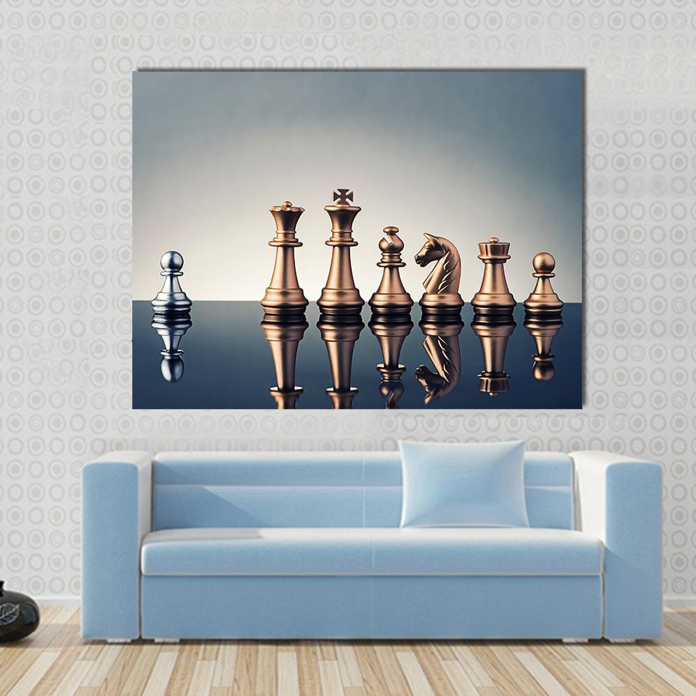 Silver Pawn Among Gold Chess Pieces Canvas Wall Art in gray, gold and silver, single panel hung on a wall