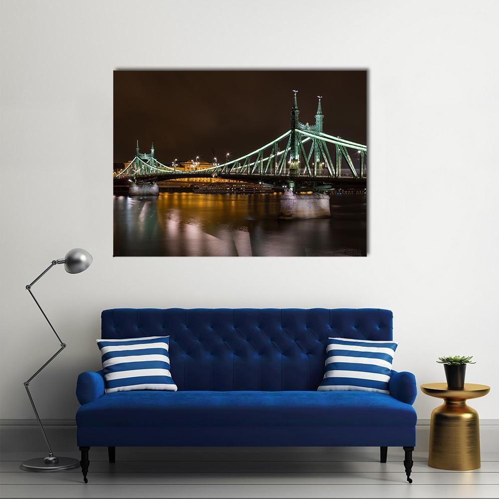 Liberty Bridge at Night, Budapest Canvas Wall Art in black, gold and green, single panel hung on a wall