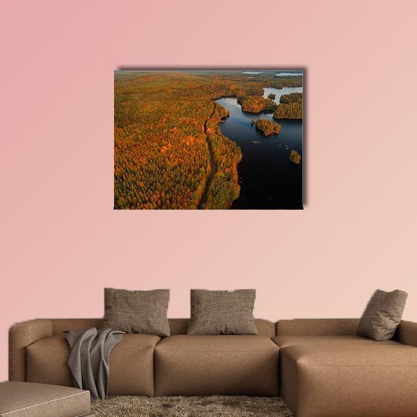 Autumn at Liesjärvi National Park Canvas Wall Art in orange, green and blue, single panel hung on a wall