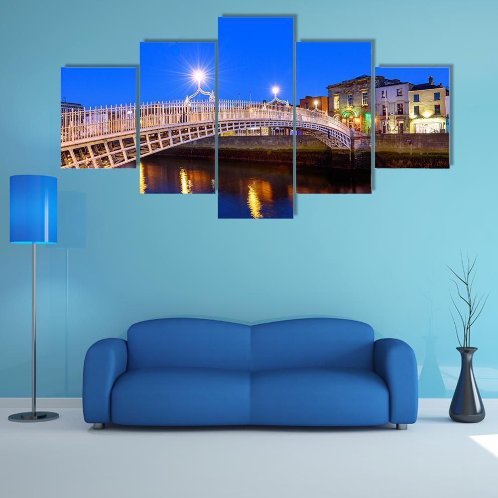 Ha'penny Bridge in Evening Canvas Wall Art in black, yellow and blue, 5 panel Star layout hung on a wall