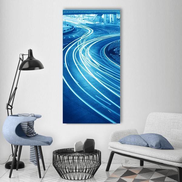 Shanghai Light Trails Over Highway Vertical Canvas Wall Art in white and blue, single vertical panel hung on a wall