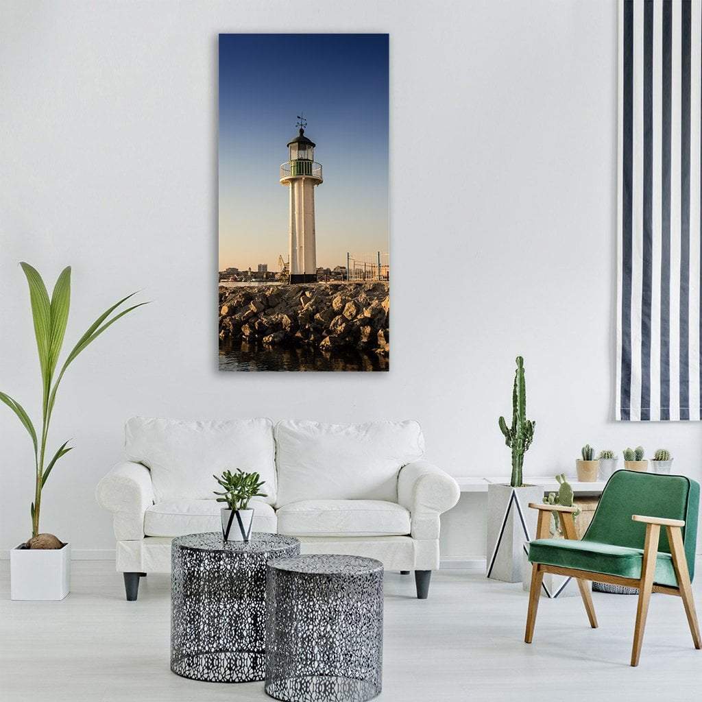 Lighthouse at Port Burgas Vertical Canvas Wall Art in white, brown and blue, single vertical panel hung on a wall
