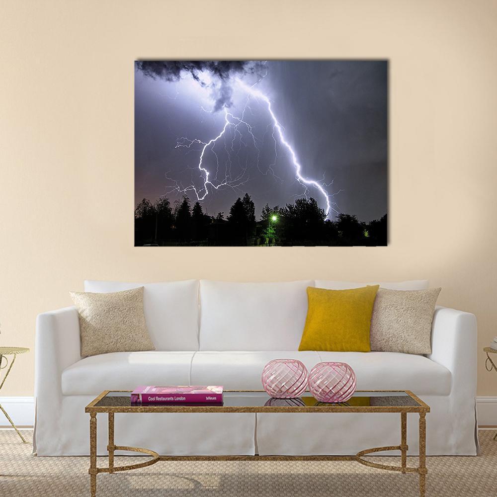 Lightning in Summer Storm Canvas Wall Art in black, gray and purple, single panel hung on a wall