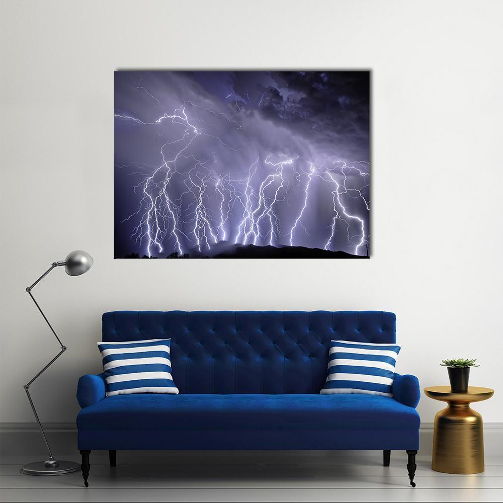 Lightning Storm Over Rincon Mountains Canvas Wall Art in black, white and purple, single panel hung on a wall