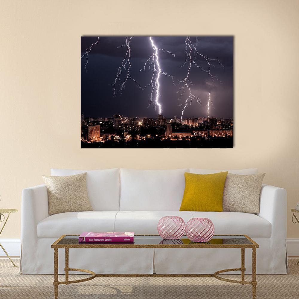 Lightning Storm Over City at Night Canvas Wall Art in black, white and purple, single panel hung on a wall