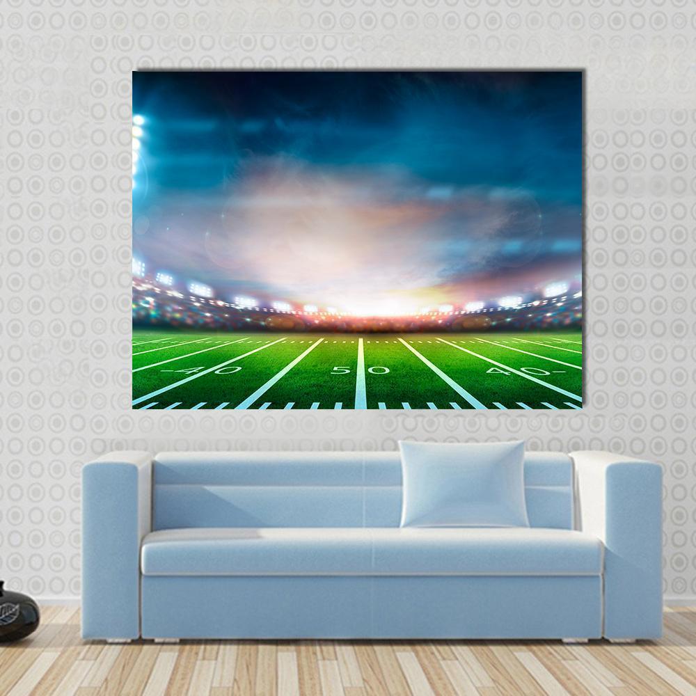 Stadium at Night Canvas Wall Art in green and blue, single panel hung on a wall