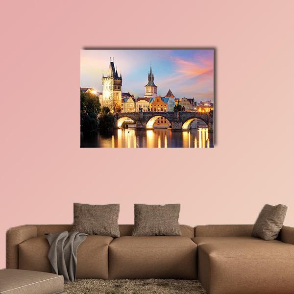 Charles Bridge at Night Canvas Wall Art in orange, yellow and blue, single panel hung on a wall