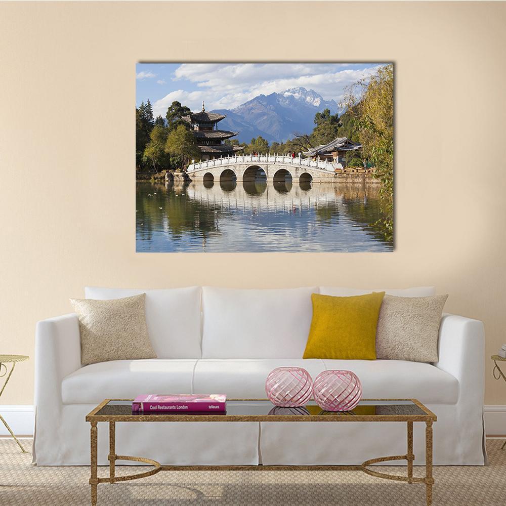 Jade Dragon Snow Mountain Canvas Wall Art in gray, green and blue, single panel hung on a wall