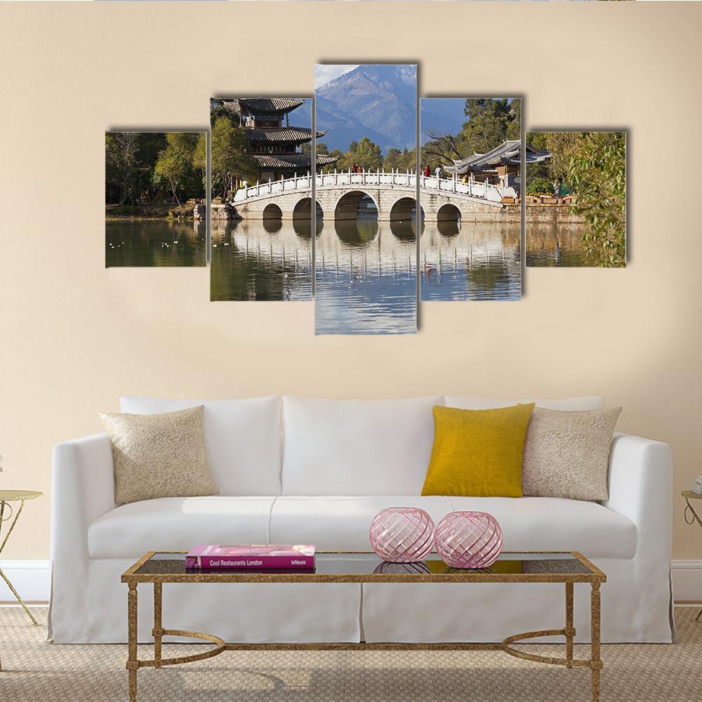 Jade Dragon Snow Mountain Canvas Wall Art in gray, green and blue, 5 panel Star layout hung on a wall