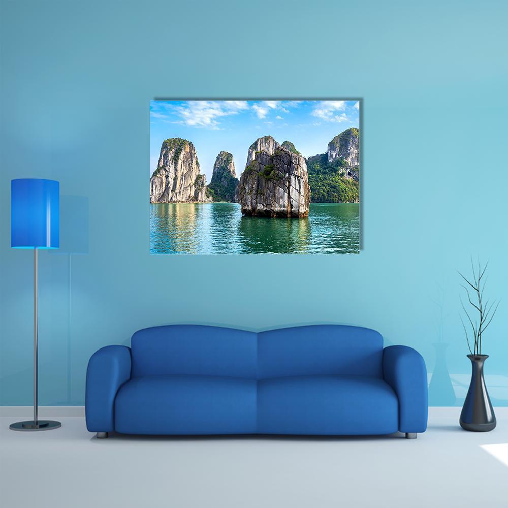 Limestone Karst Islands Over Turquoise Water Canvas Wall Art in gray, green and blue, single panel hung on a wall