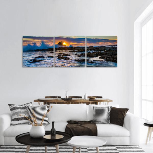 Little Corona Beach Sunset Panoramic Canvas Wall Art in orange, yellow and blue, hung on a wall