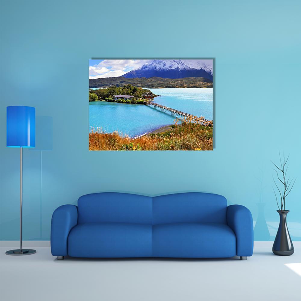 Little Island on Mountain Lake Canvas Wall Art in brown, green and blue, single panel hung on a wall
