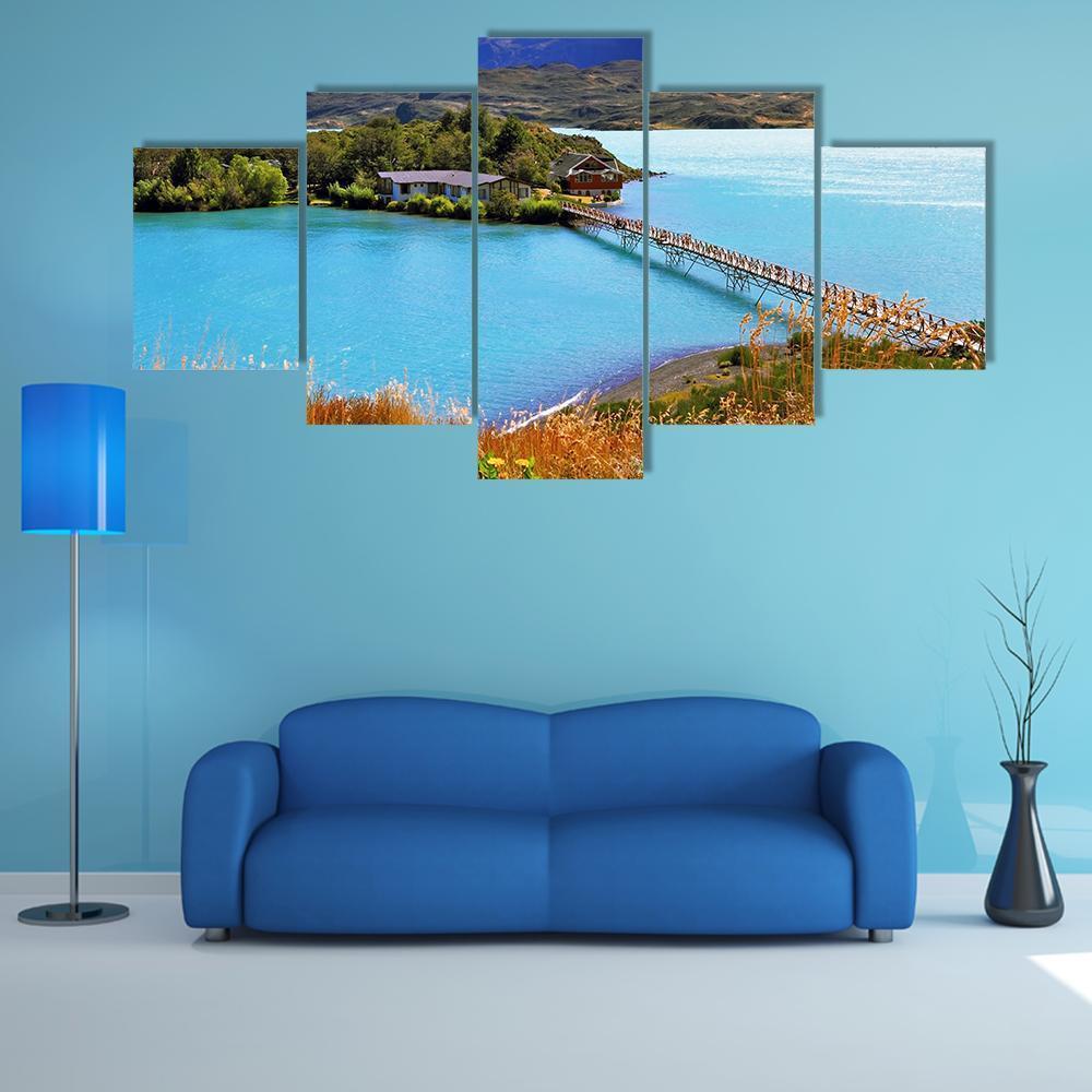 Little Island on Mountain Lake Canvas Wall Art in brown, green and blue, 5 panel Star layout hung on a wall