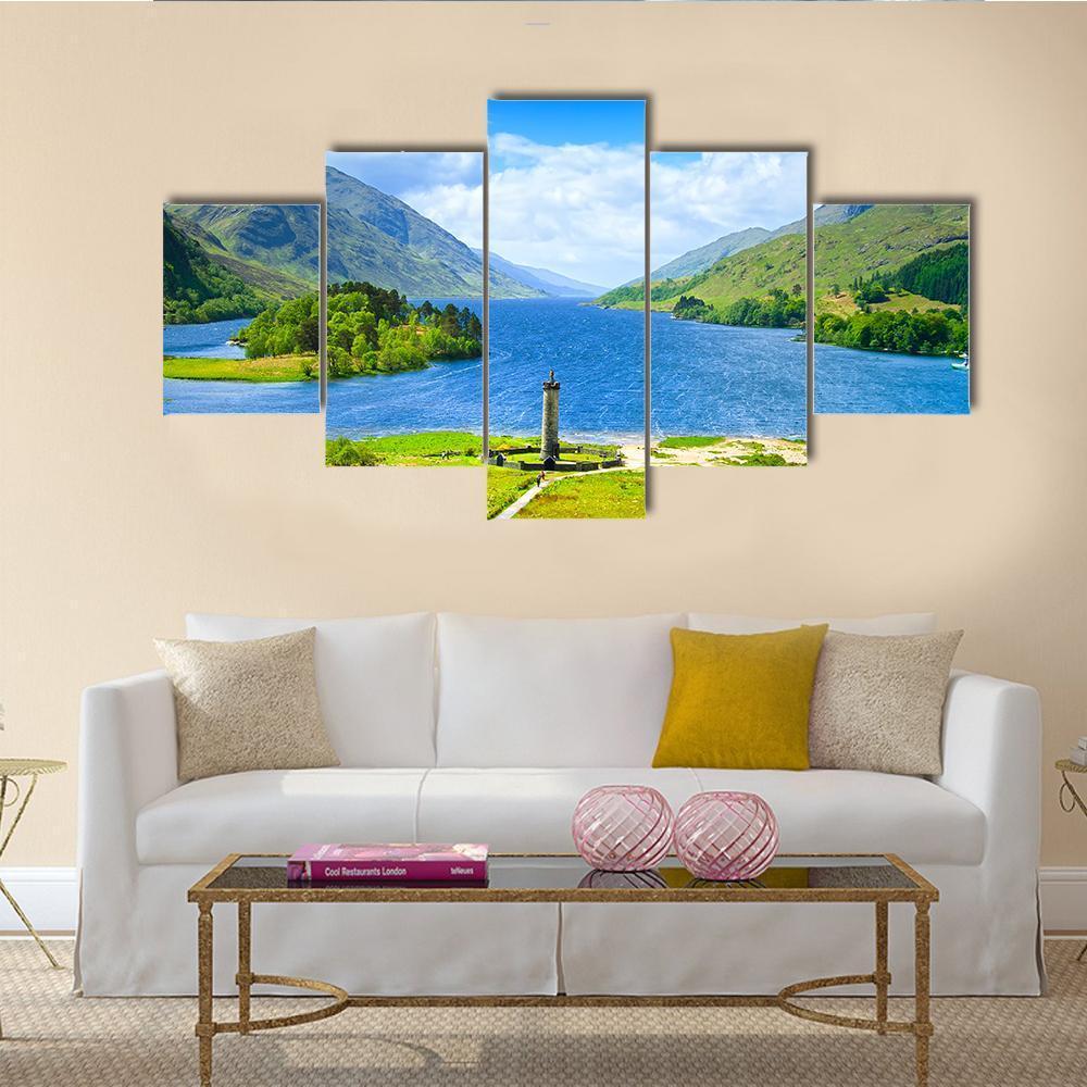 Loch Shiel Lake with Stone Monument Canvas Wall Art in gray, green and blue, 5 panel Star layout hung on a wall