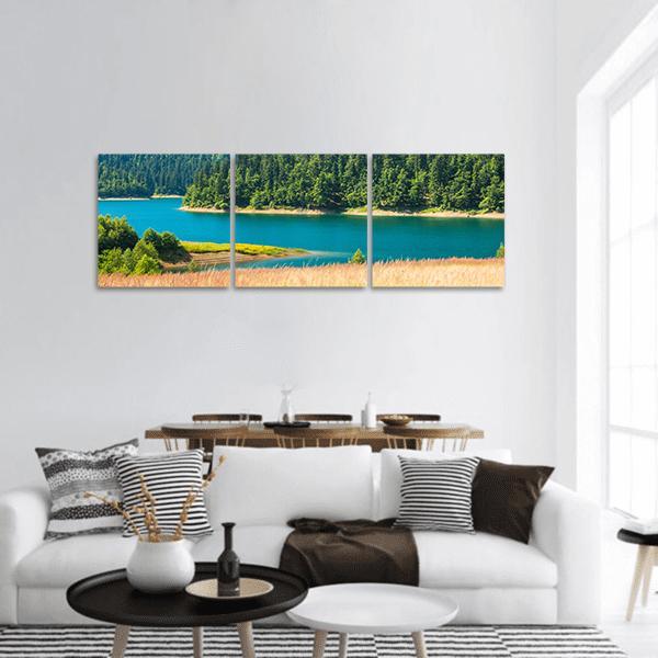 Lokvarsko Lake Turquoise Shoreline Panoramic Canvas Wall Art in beige, green and blue, hung on a wall