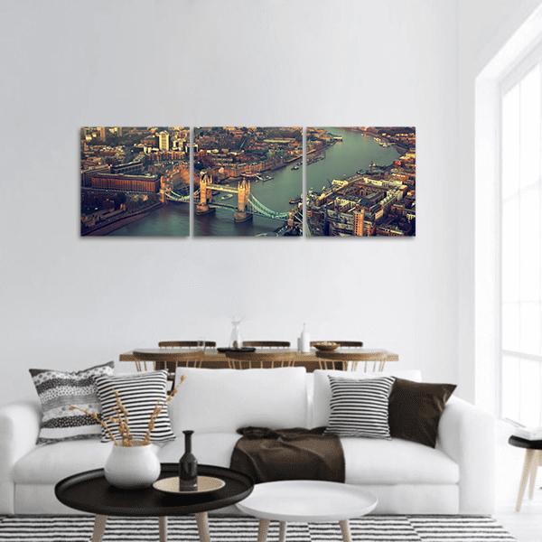 Tower Bridge Aerial View at Dusk Panoramic Canvas Wall Art in brown, orange and blue, hung on a wall
